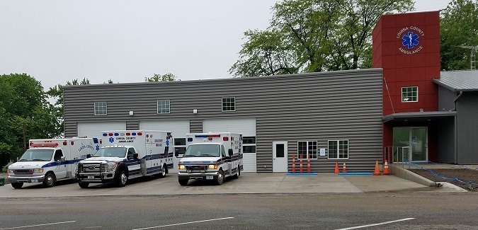 louisa county ambulance building front with three ambulances parked outside 